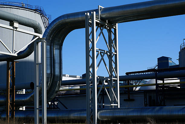 istock industrial pipelines on pipe-bridge against blue sky 91721542