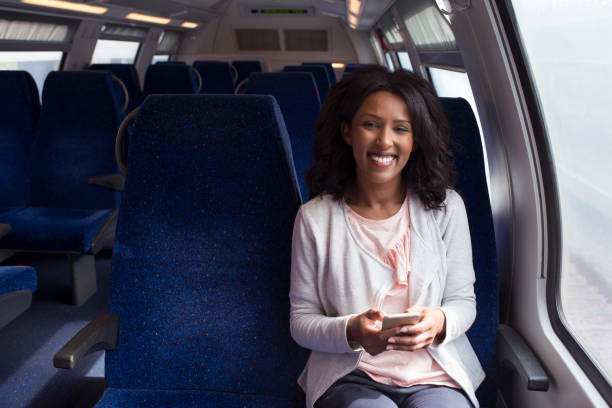 istock Woman texting, sitting in the train. 917217342