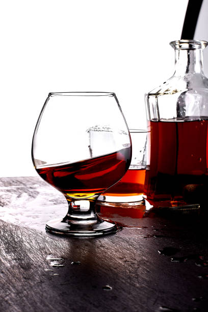 istock Glass of splash whiskey with bottle. 917217598
