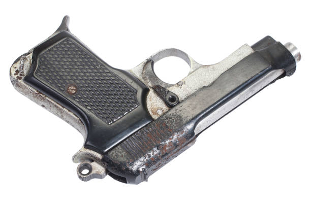 istock Old rusty vintage pistol on white 917217648