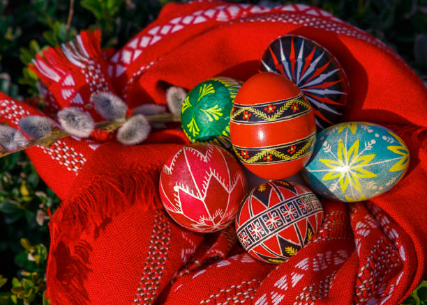 istock Easter eggs in red embroidered towel with pussy-willow branches. easter background. 917224218