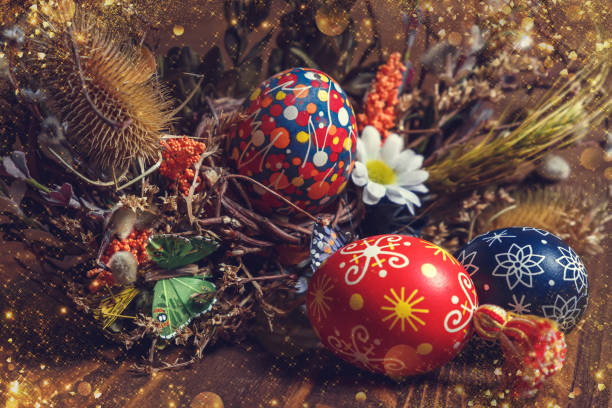 istock Easter background. colored Easter eggs and composition of dried flowers and plants. on wooden background. Easter theme. Happy Easter. 917225450