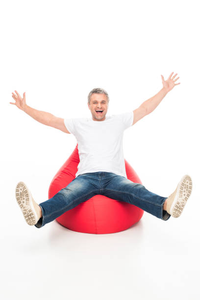 istock excited man on bean bag chair 917225456