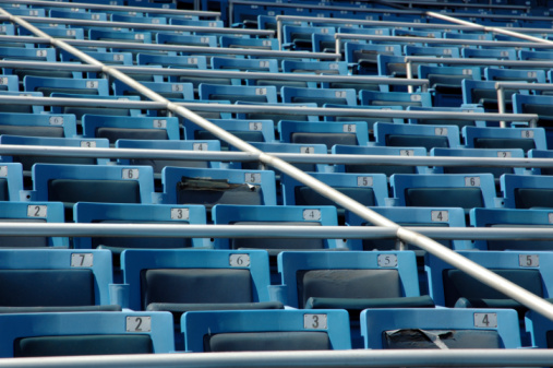 Close up view of box seats at a stadium, with front focus.