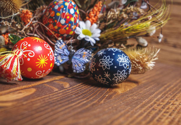 istock Easter background. colored Easter eggs and composition of dried flowers and plants. on wooden background. Easter theme. Happy Easter. 917227788