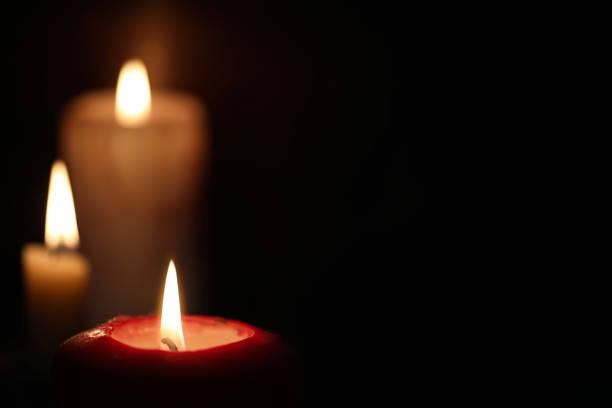 istock Burning candle flame in the dark 917228124