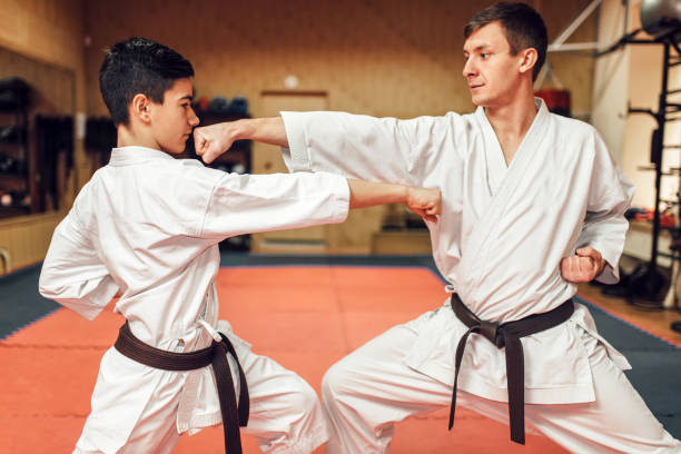 istock Martial arts masters, self-defence practice in gym 917228162