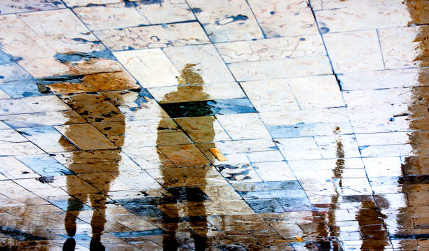 istock Blurry people reflections on a rainy day 917229422