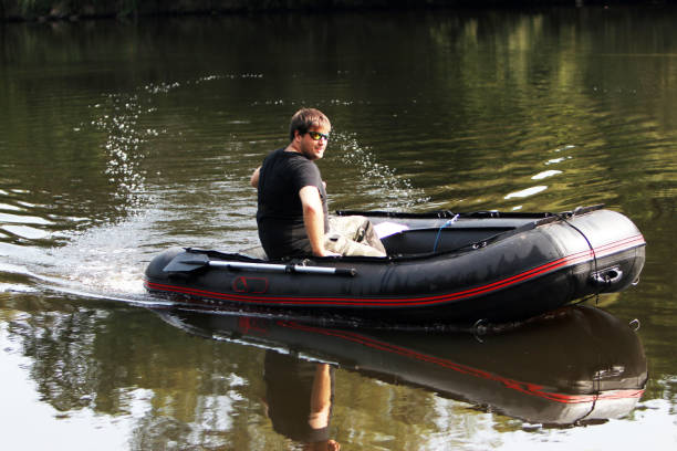 istock Young man in inflatable boat 917229680