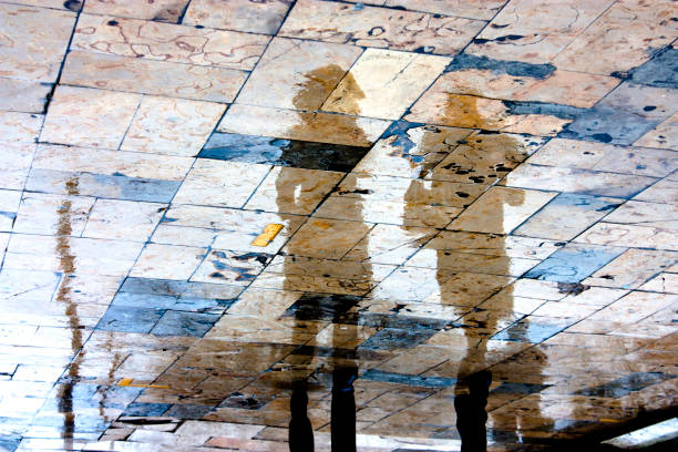 istock Blurry people reflections on a rainy day 917229718