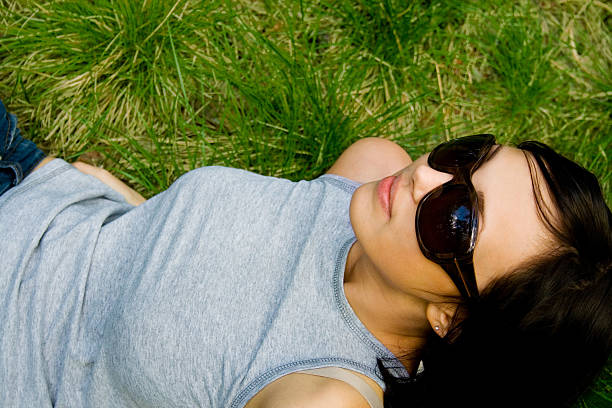 istock young girl on green grass 91723091