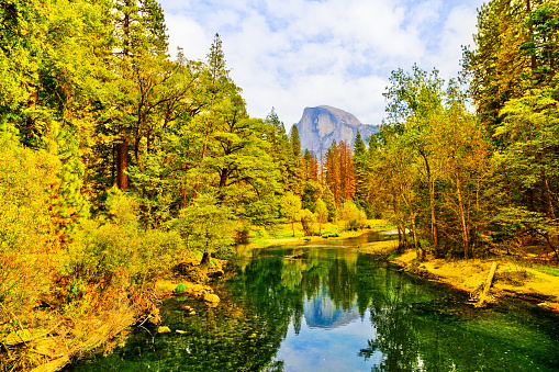 Half Dome and Merced River from Yosemite Valley in Yosemite National Park in autumn.