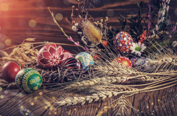 istock Easter background. colored Easter eggs and composition of dried flowers and plants. on wooden background. Easter theme. Happy Easter. 917232830