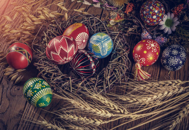 istock Easter background. colored Easter eggs and composition of dried flowers and plants. on wooden background. Easter theme. Happy Easter. 917233646