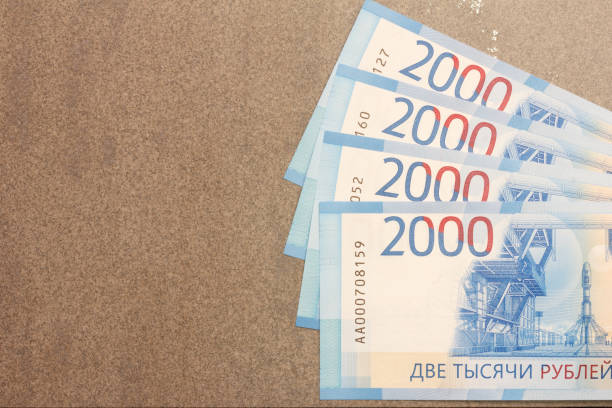 New Russian banknotes denominated in 2000 rubles on a gray background with copy space