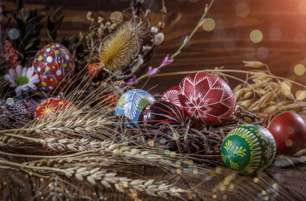 istock Easter background. colored Easter eggs and composition of dried flowers and plants. on wooden background. Easter theme. Happy Easter. 917236030