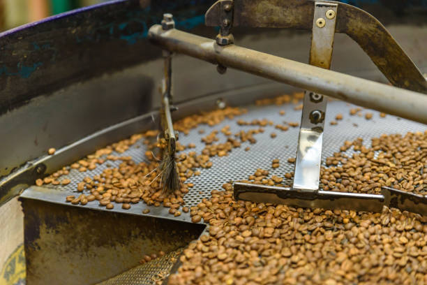 istock Coffee beans during the roasting process. Drum type roaster. Rosting process of coffee. 917236250