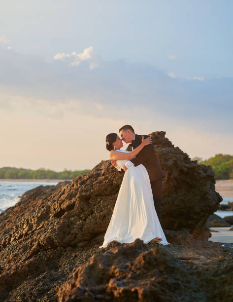 istock Young bride and groom kiss 917236494