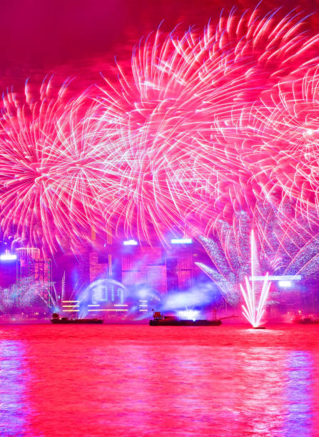 Firework display on the New Year’s Eve in Hong Kong. Firework display on the New Year’s Eve at the Victoria Harbor in Hong Kong. hong kong moon night stock pictures, royalty-free photos & images