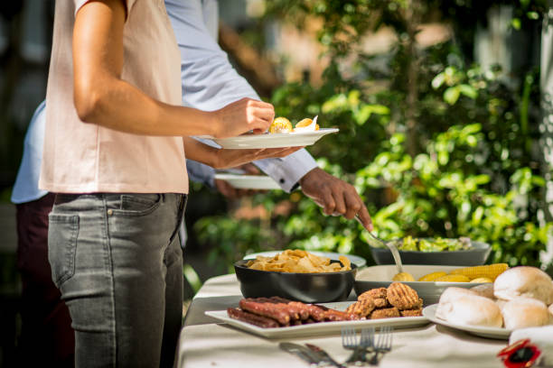 istock Friends enjoy a picnic on a beautiful sunny day 917238300
