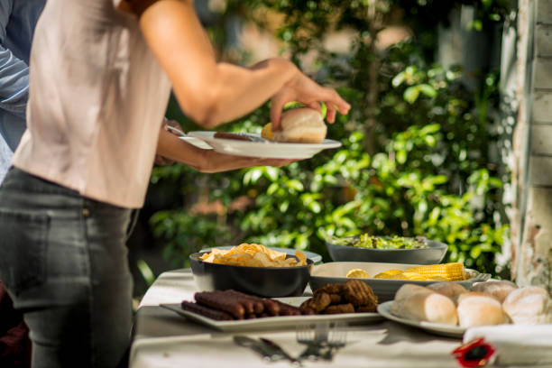 istock Friends enjoy a picnic on a beautiful sunny day 917238318