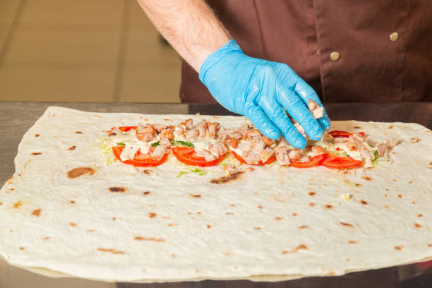 istock Cooking Shawarma. Unfolded view closeup. High-calorie food. 917245252