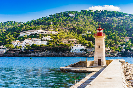 Idyllic view of the lighthouse in Port de Andrats, harbor on Mallorca island, Spain