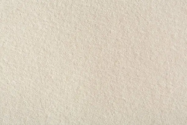 Beige paper background texture. High resolution photo.