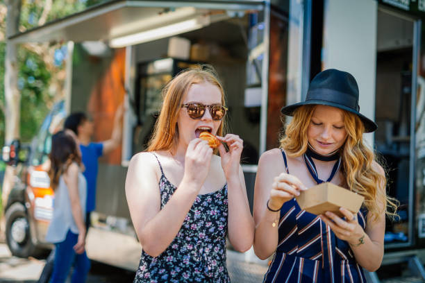 istock Two best friends sharing meal 917250518
