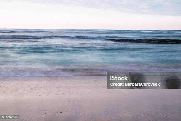 Beautiful Breaking Waves On Sandy Beach On Atlantic Ocean In Sunset Sky Hendaye Basque Country France Stock Photo - Download Image Now