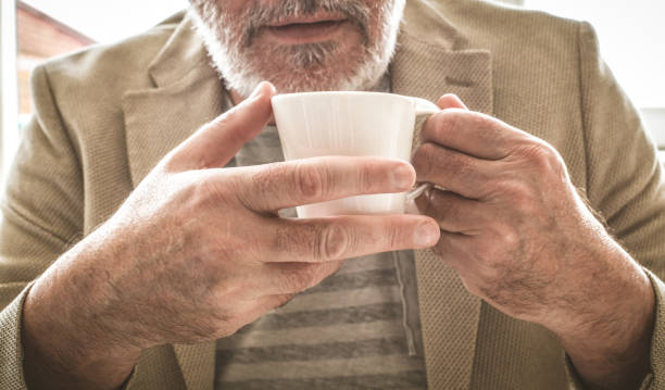 istock Old businessman need a coffee break. Close up. 917255438