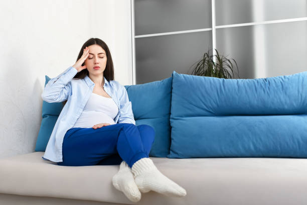 istock pregnant woman with a headache 917256346