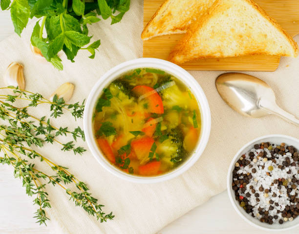 istock Delicious thick Soup with mixed vegetables - cauliflower, broccoli, carrots, potatoes, garlic, tomatoes.  Healthy diet food. Top view, copy space for text 917263156