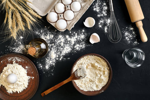 istock Pasta cooking ingredients on black kitchen table. Top view with space for your text 917263406