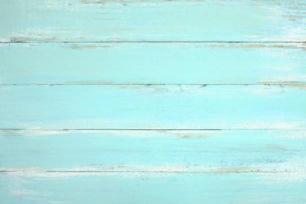wooden plank painted in blue Vintage beach wood background - Old weathered wooden plank painted in blue color. green painted wood texture stock pictures, royalty-free photos & images