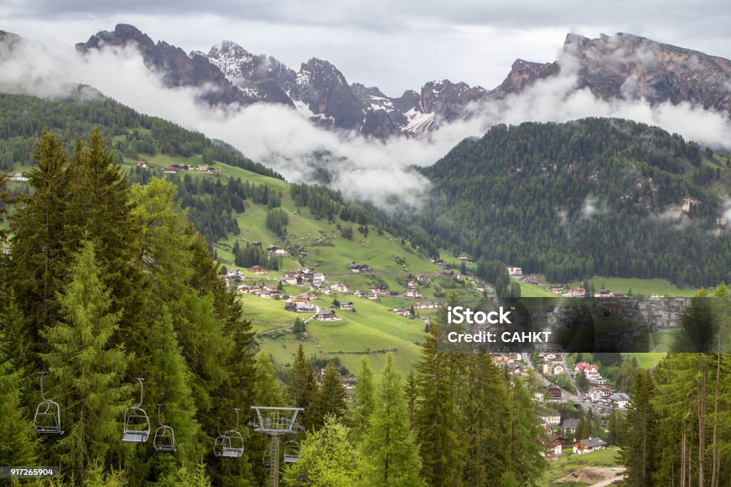 Empty lifts in Alps View of lifts and landscape of the alpine village between mountains, South Tyrol Adige River Stock Photo