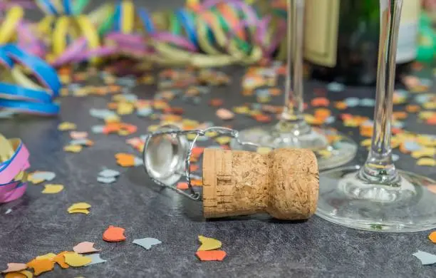 Champagne cork with carnival decoration on a slate