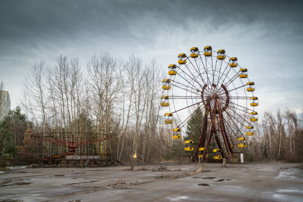 Ferris wheel in Pripyat Abandoned ferris wheel in amusement park in Pripyat, Ukraine chornobyl photos stock pictures, royalty-free photos & images