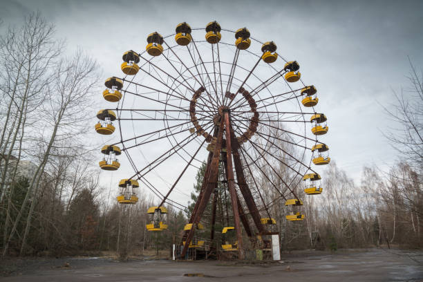 Ferris wheel in Pripyat Abandoned ferris wheel in amusement park in Pripyat, Ukraine pripyat city stock pictures, royalty-free photos & images
