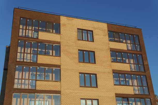 istock New apartment building with balconies against the blue sky 917276404