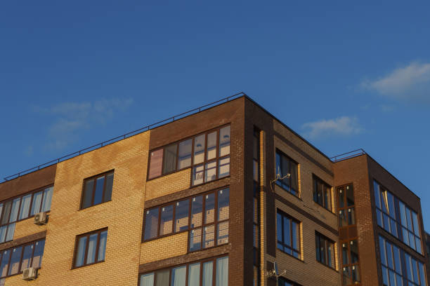 istock New apartment building with balconies against the blue sky 917276580