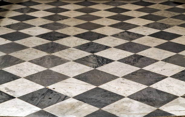 istock Black and white checkered Perspective view floor grunge tiles marble surface decorative stone interior 917276658