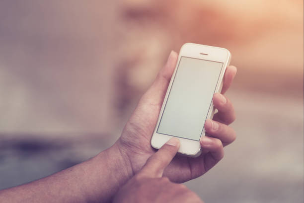istock Closeup of man's hand using smartphone with copy space. 917279390