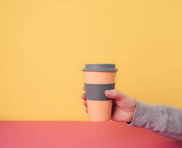 istock Take away coffee cups on colorful paper background 917283008
