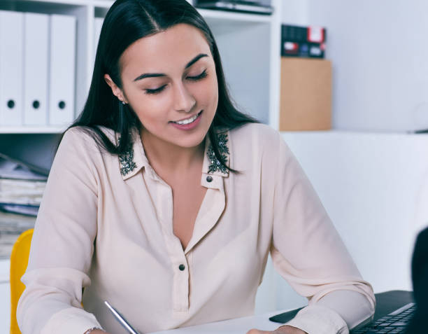 istock Smiling businesswoman speaking with costumer in office. 917286968