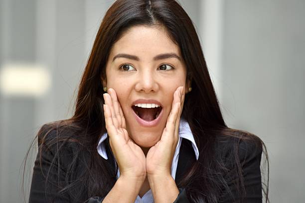 istock Surprised Hispanic Person Wearing Suit 917286990