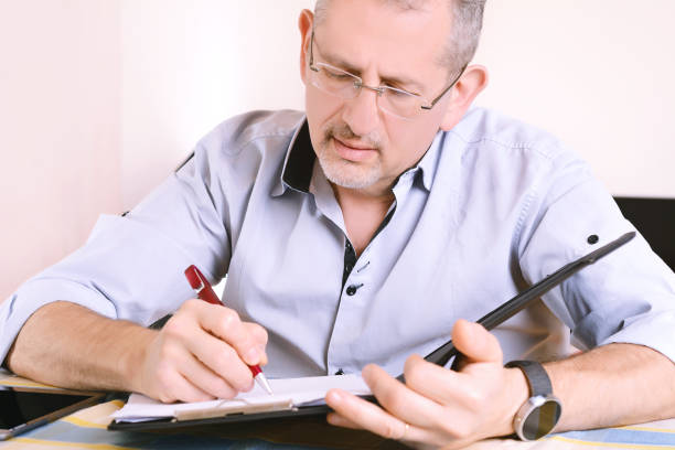 istock Close-up of businessman signing a document 917287768