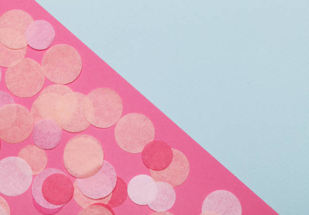 istock Pink confetti on pastel pink background. Festive background  for your design. 917291484