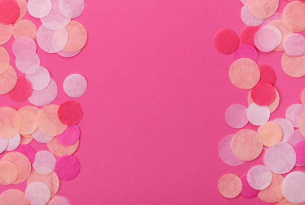 istock Pink confetti on pastel pink background. Festive background  for your design. 917291568