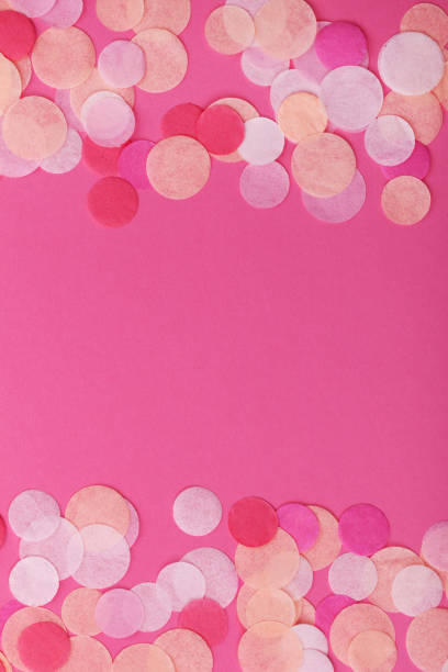 istock Pink confetti on pastel pink background. Festive background  for your design. 917291722
